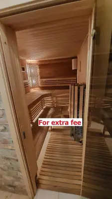 a hallway with a sign that reads for extra fee at Fun and chill patalpu ir pirties nuoma in Vilnius