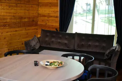 a table with a plate of food on top of it at Hotel resort Sedula in Skogalis