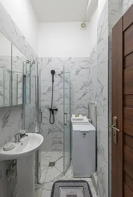 a bathroom with a sink and a shower at Prestigious city center apartment with free parking by Polo Apartments in Kaunas