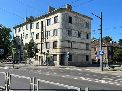an old building on the corner of a street at Juozapaviciaus apartment in Kaunas