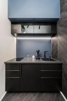 a kitchen with a sink and a counter top at Butas su Jacuzzi Kauno miesto centre in Kaunas