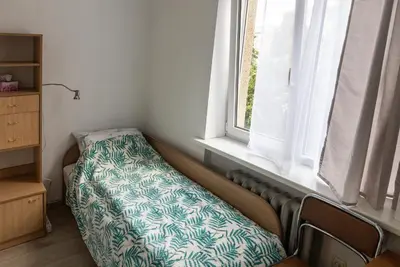 a bed in a room with a window at Mini Studio Vilnius Centre in Vilnius