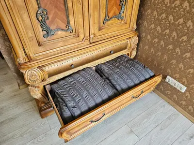 a wooden frame with a bench in a room at Square apartments in Rokiškis