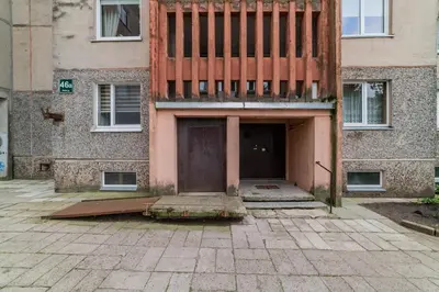 a building with a door in front of it at A.P. Apartment in Šiauliai
