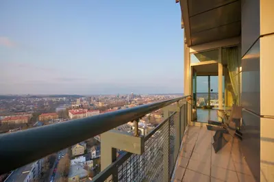 a view from the balcony of a building at Helios Extra Apartment in Vilnius skyscraper 20 floor in Vilnius