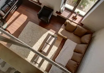 an overhead view of a living room with a couch and a tv at Loft 66/A nice view Vilnius in Vilnius