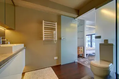 a bathroom with a toilet and a sink at Loft 66/A nice view Vilnius in Vilnius