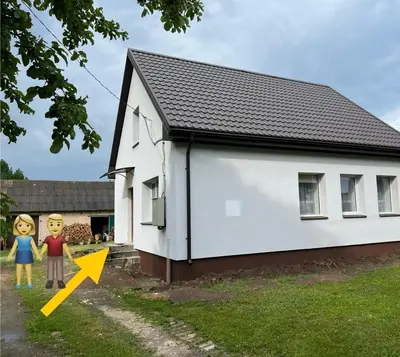 a small white house with an arrow pointing to it at Naisiai-2 in Naisiai