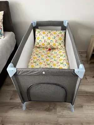 a bed with a bed frame in a room at Naisiai in Naisiai