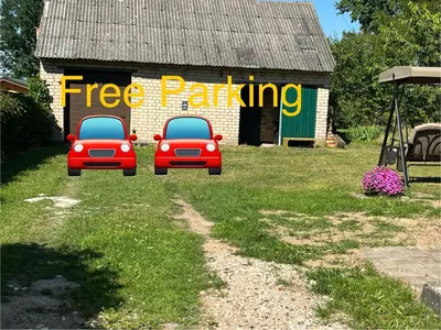 two red cars parked in front of a building at Naisiai in Naisiai