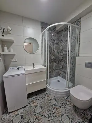 a bathroom with a toilet and a sink and a shower at Apartments in Lazdijai in Lazdijai