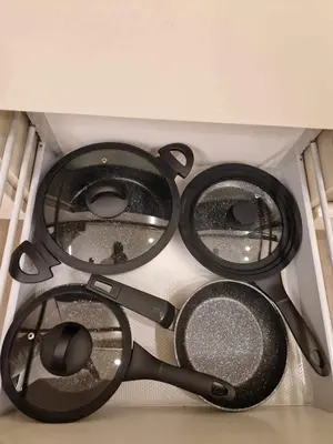 a group of four pots and pans in a ceiling at Centro apartamentai in Panevėžys