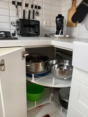 a kitchen with two pots and pans on a shelf at Spacious Old Town Apt, 3 Rooms, Sleeps 6-7 in Kaunas