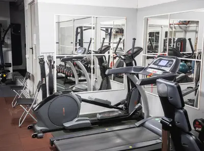 a gym with a bunch of exercise bikes in it at Capsule Hostel Logistic Vilnius in Vilnius