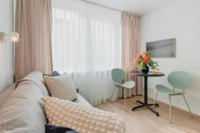 a living room with a couch and a table at Apartment in Žvėrynas in Vilnius