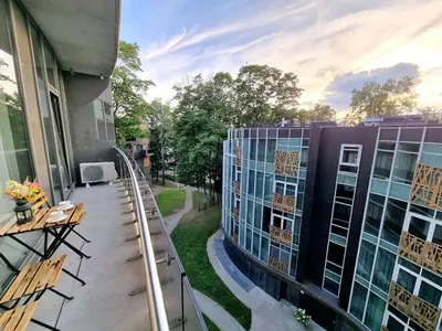 a balcony with a roller coaster on a building at ALEGRE apartment in Druskininkai