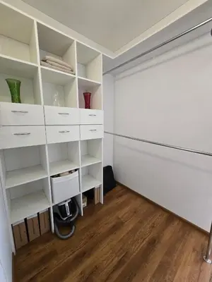a room with white shelves and a closet at The cosiest apartment in Vilnius in Vilnius