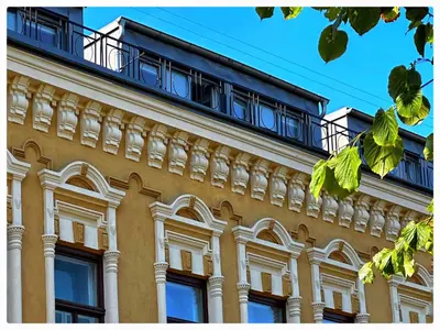 a building with a balcony on top of it at Apartaments in the city centre in Kaunas