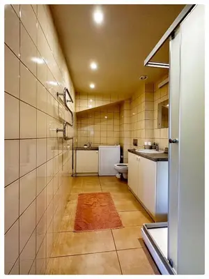a bathroom with a sink and a toilet in a room at Apartaments in the city centre in Kaunas