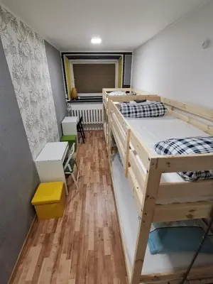 a dorm room with two bunk beds in it at Tiki Taka Hostel & Pub in Vilnius
