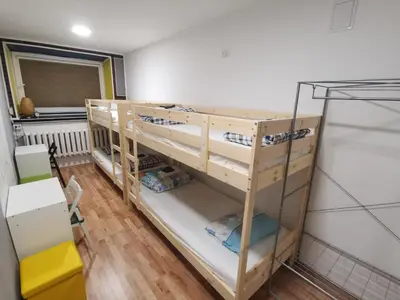 a room with two bunk beds in a room at Tiki Taka Hostel & Pub in Vilnius