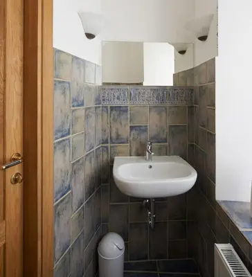 a bathroom with a sink and a toilet at Cottage in old town in Vilnius
