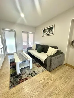 a living room with a couch and a coffee table at Kaunas Stay Apartment in Kaunas