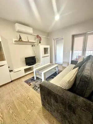 a living room with a couch and a table at Kaunas Stay Apartment in Kaunas