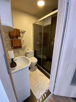 a bathroom with a shower and a sink and a toilet at Nice place to stay close to city in Kaunas