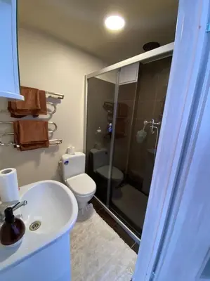 a bathroom with a toilet and a sink and a shower at Nice place to stay close to city in Kaunas