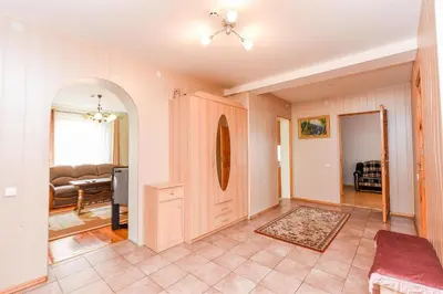 a living room with a door and a couch at Birutes Houses in Druskininkai