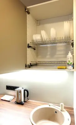 a kitchen sink with a coffee pot on a counter at Jaukus Koko butas 1 aukšte in Kaunas