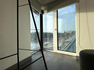 a room with a view of a large window at Nemunas River View Apartment in Kaunas