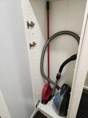 a vacuum cleaner in a cabinet in a room at near the old town in Kaunas
