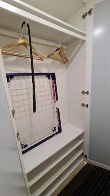a walk in closet with a window and a shelf at near the old town in Kaunas