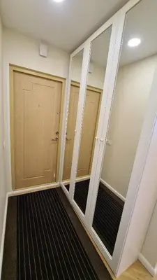 a walk in closet with glass doors in a room at near the old town in Kaunas