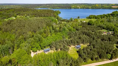 an aerial view of a home with a lake at Chill Hill Kalviai in Kalviai