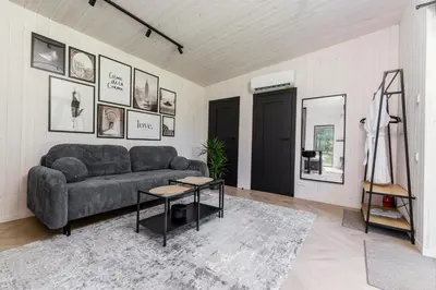 a living room with a couch and a table at Chill Hill Kalviai in Kalviai
