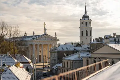 a view of a city with a church tower at CATHEDRAL Old Town Suites in Vilnius