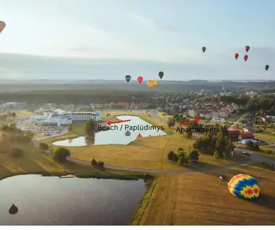 a group of hot air balloons flying over a park at Resort Stories Išskirtiniai 7 vietų apartamentai Birštone in Birštonas