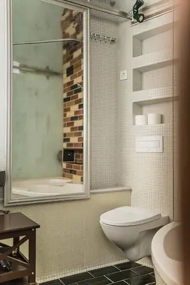 a bathroom with a toilet and a shower and a sink at Quiet and Cosy apartment in Kaunas Old Town in Kaunas