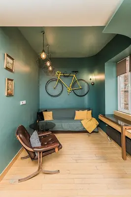 a living room with a bike hanging on the wall at Quiet and Cosy apartment in Kaunas Old Town in Kaunas