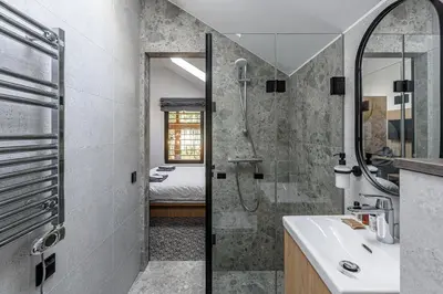 a bathroom with a shower and a sink at Molėtairesort in Molėtai