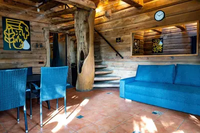 a living room with a blue couch and chairs at Ivanas Countryside in Bražuolė