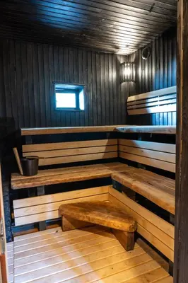 a room with wooden benches in a cabin at Ivanas Countryside in Bražuolė