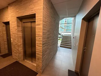a hallway of a building with a wooden wall at Moon apartment in Druskininkai
