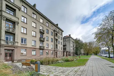 an empty street in front of a building at Arena Park Apartment in Kaunas