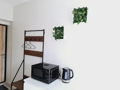 a microwave sitting on a counter in a room at Kaunas Center Studio in Kaunas