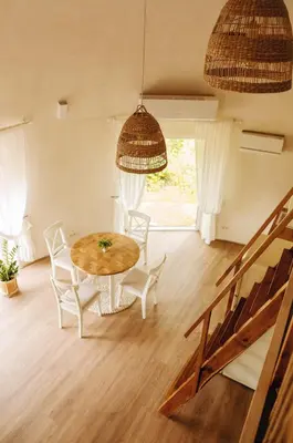 a dining room with a table and chairs at Kupolinis namelis in Kilova II