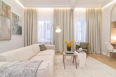 a living room with a couch and a table at #stayhere - Authentic & Artsy Studio in Heart of Vilnius Old Town in Vilnius